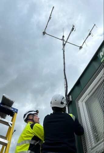 offshore workers installing a Landfall Site Antenna